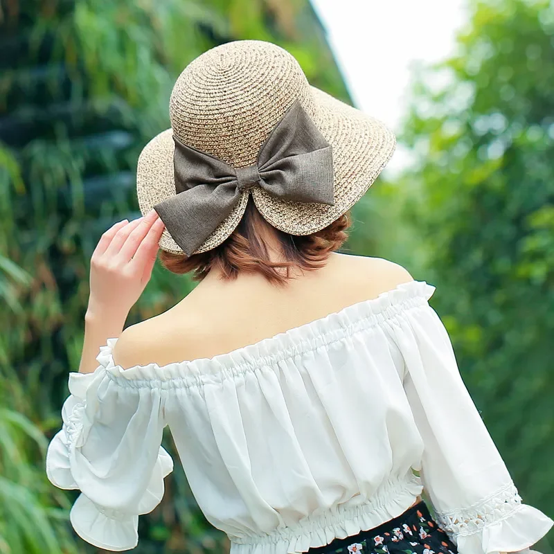 

Fashionable sun hat for women with wide brim and split ends design made of natural straw featuring bow detail ideal for