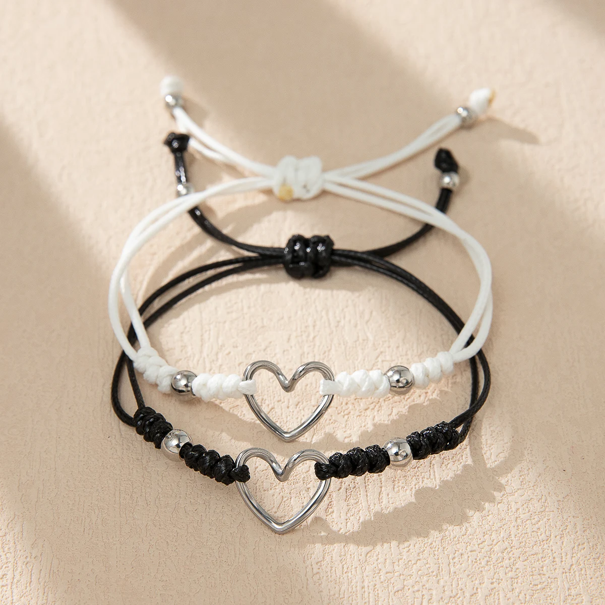 Couple's Hand Rope with Hollow Heart Knot Positioning Beads Black White Rope Matching Love Knots for Couples