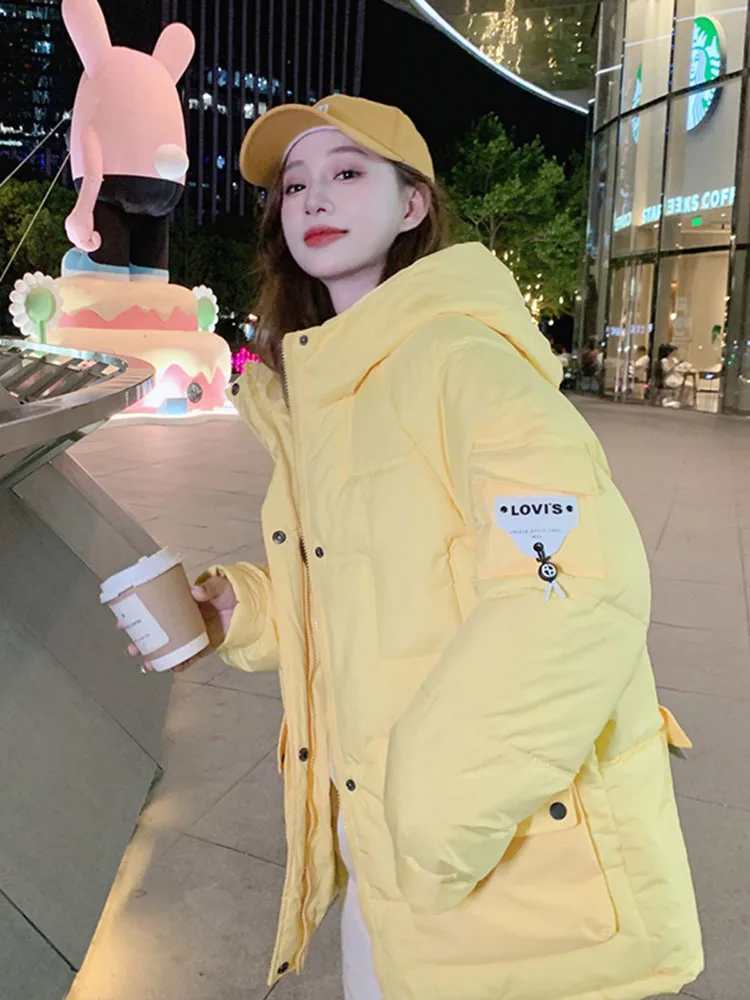 Neue Winter jacke Frauen Kapuzen mantel feste Taschen Baumwolle gepolstert warmen Puffer Parkas Daunen koreanische dicke Mode lose