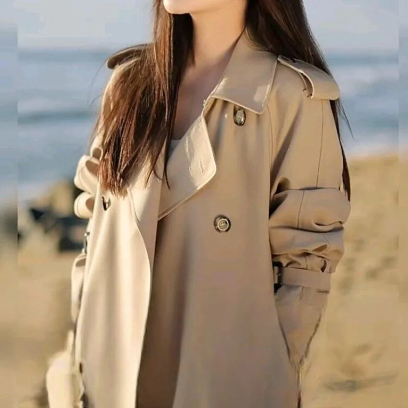 2025 feminino outono e inverno novo emendado gola meio aberta botão bolso moda solta jaqueta corta-vento de comprimento médio