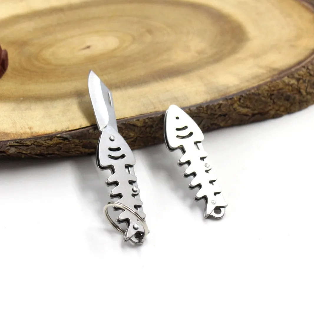 Mini cuchillo plegable para exteriores, creativo, hueso de pescado, Unboxing, llavero de bolsillo portátil, herramienta táctica EDC de acero inoxidable, colgante cortador
