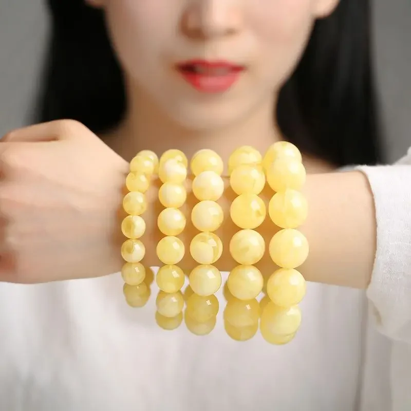 

UMQ Natural Russian old beeswax white nectar bracelet 108 men's and women's chanterelle yellow honey bead bracelet