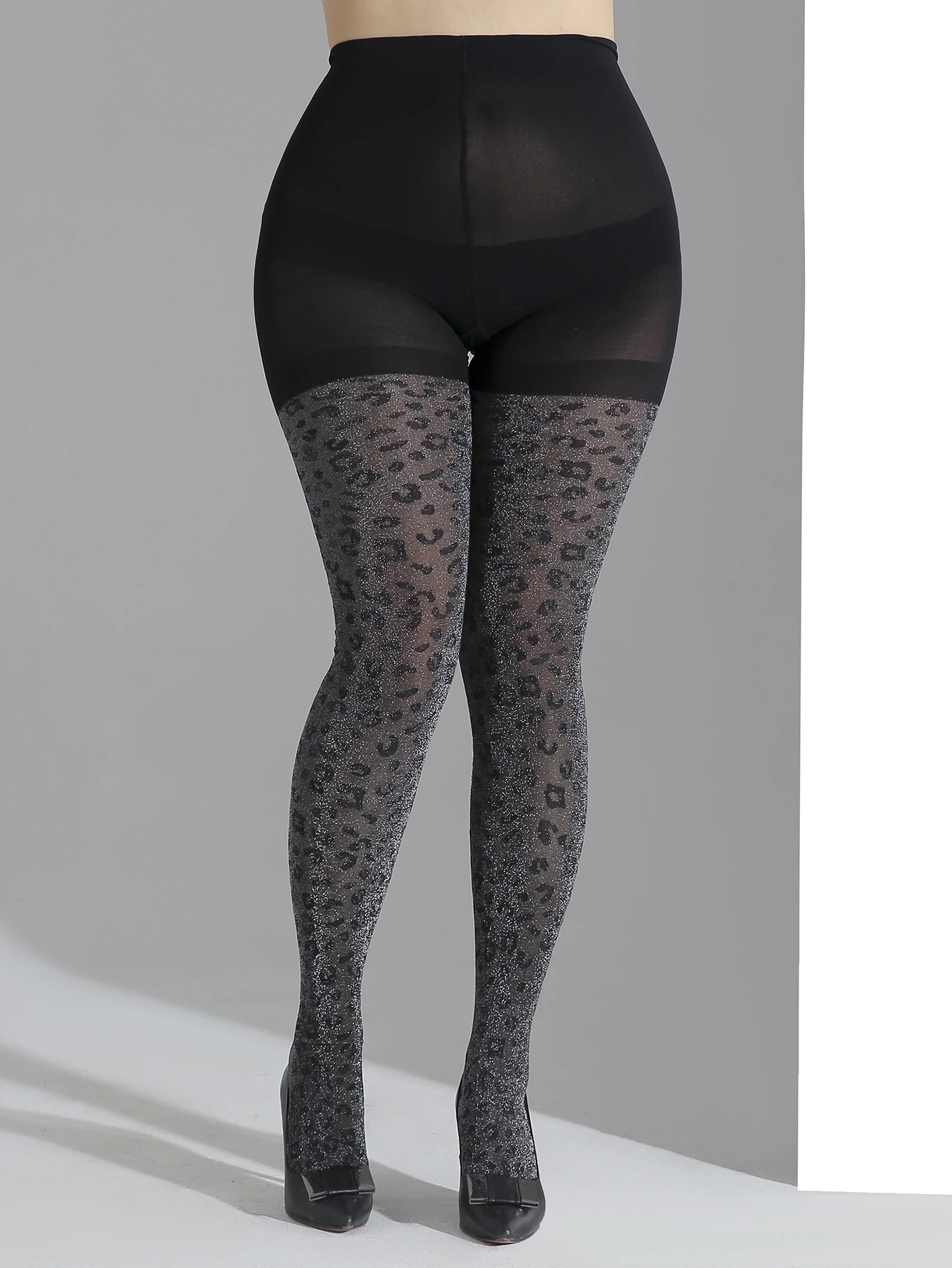 

A pair of women's black plus size opaque bright silver leopard pantyhose sexy high elastic tights
