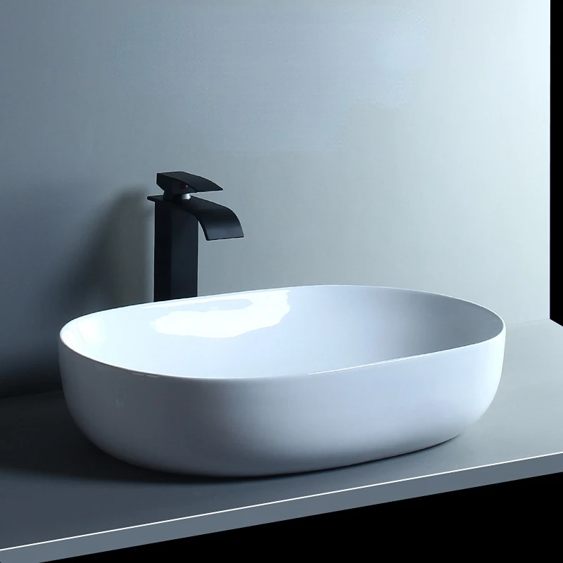 

Nordic simple tabletop basin Oval single basin Toilet ceramic tabletop basin Basin balcony basin