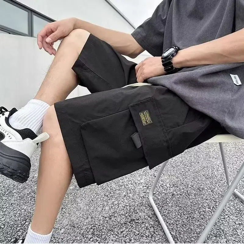 ยาว Baggy พร้อมกระเป๋าเอวยางยืดหลวม Draw String กางเกงขาสั้นสําหรับชายเบอร์มิวดา Half Oversize Mens Cargo กางเกงขาสั้นกว้าง
