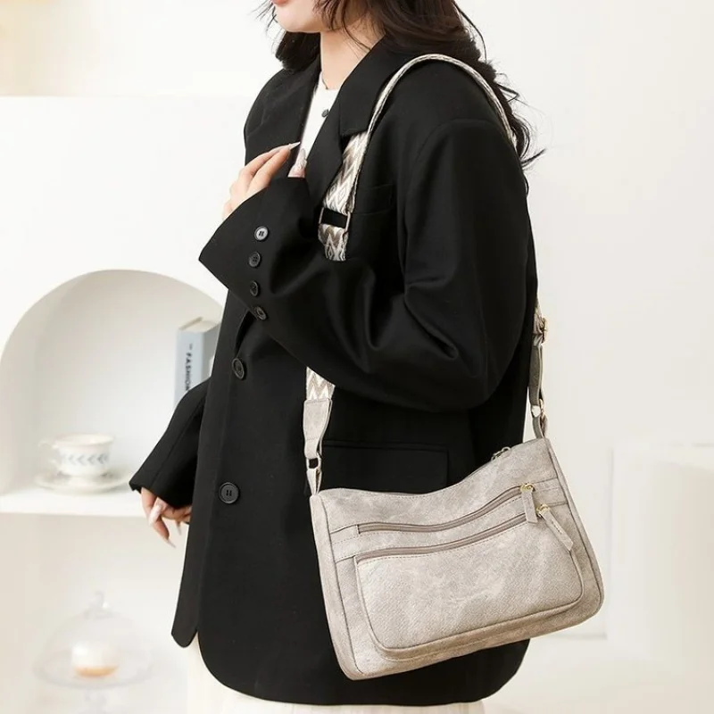 

Luxury Women's Messenger Bag With Fine Leather And Famous Designer Details For Commuter Use​