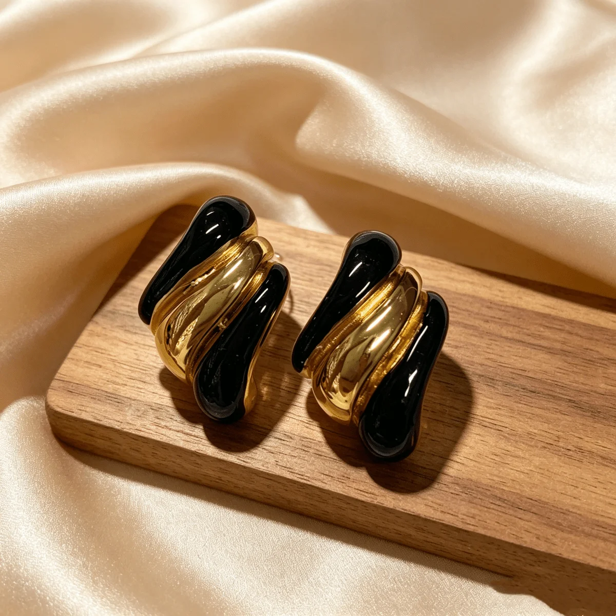 

Stainless Steel Twisted Black And Gold Tone Earrings For Women