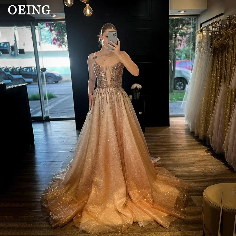 

OEING Sparkly Gold A Line Prom Dresses Sexy Spaghetti Strap Sheer Neck Sequins Evening Gowns Glitter Wedding Party Dress Event