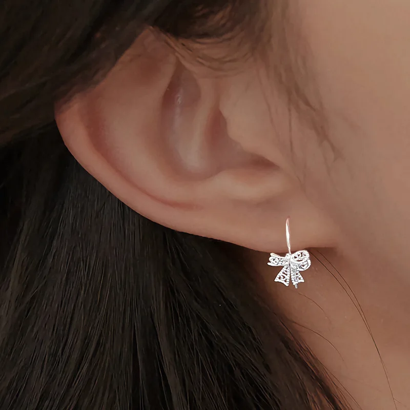 Korean-Style S999 Sterling Silver Fresh Chic Hollow-Out Bow Stud Earrings for Women – Elegant Cartilage Piercing, Sleep-Friendly