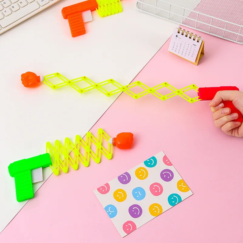 Children's April Fool's Day Prank Novelty Funny Toy Retractable Fist Shooting Skill Gun Decompression Retractable Classic Toy