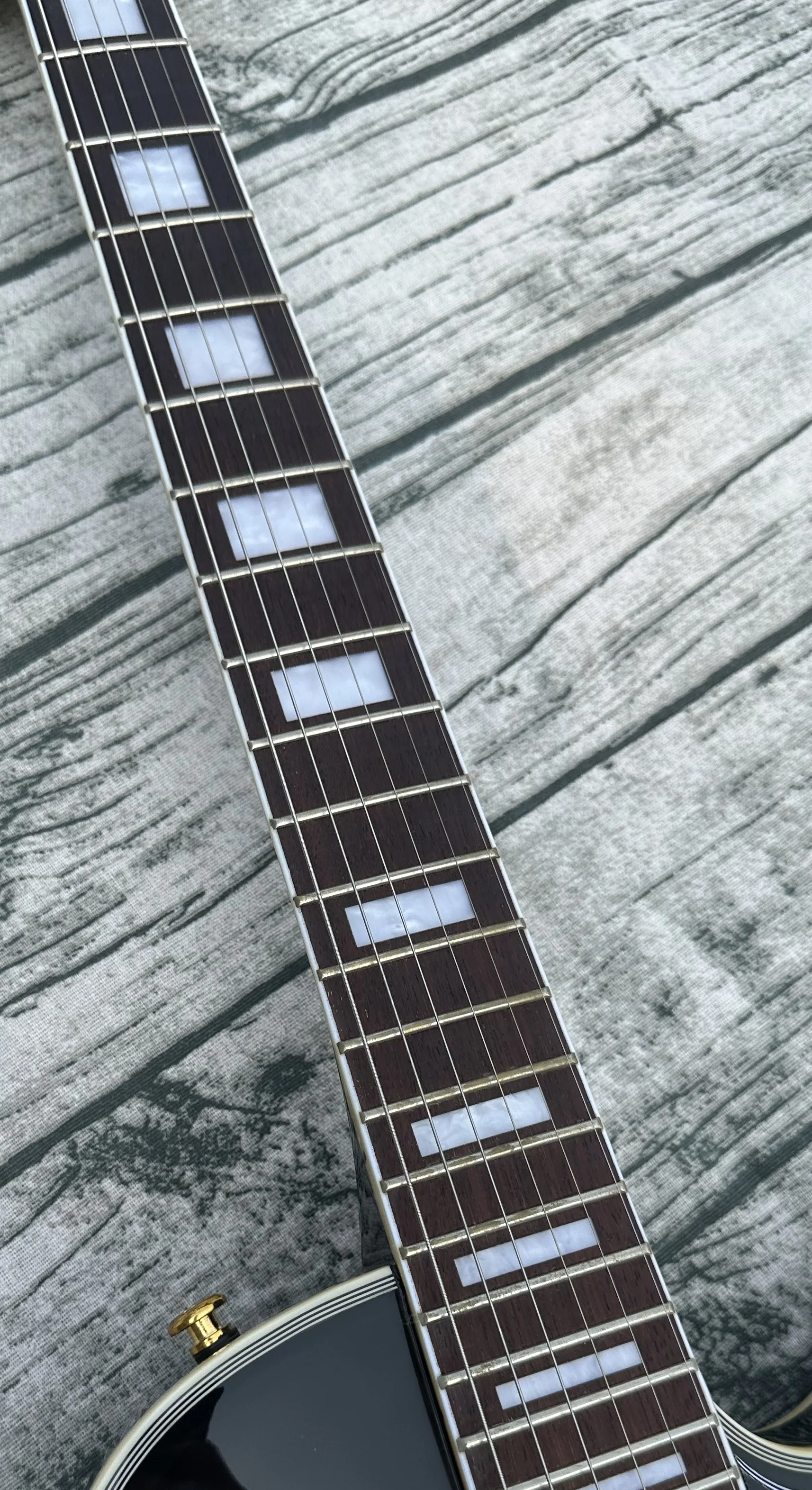 Customized electric guitar, black caston, Imported wood,gold accessories, lightning package