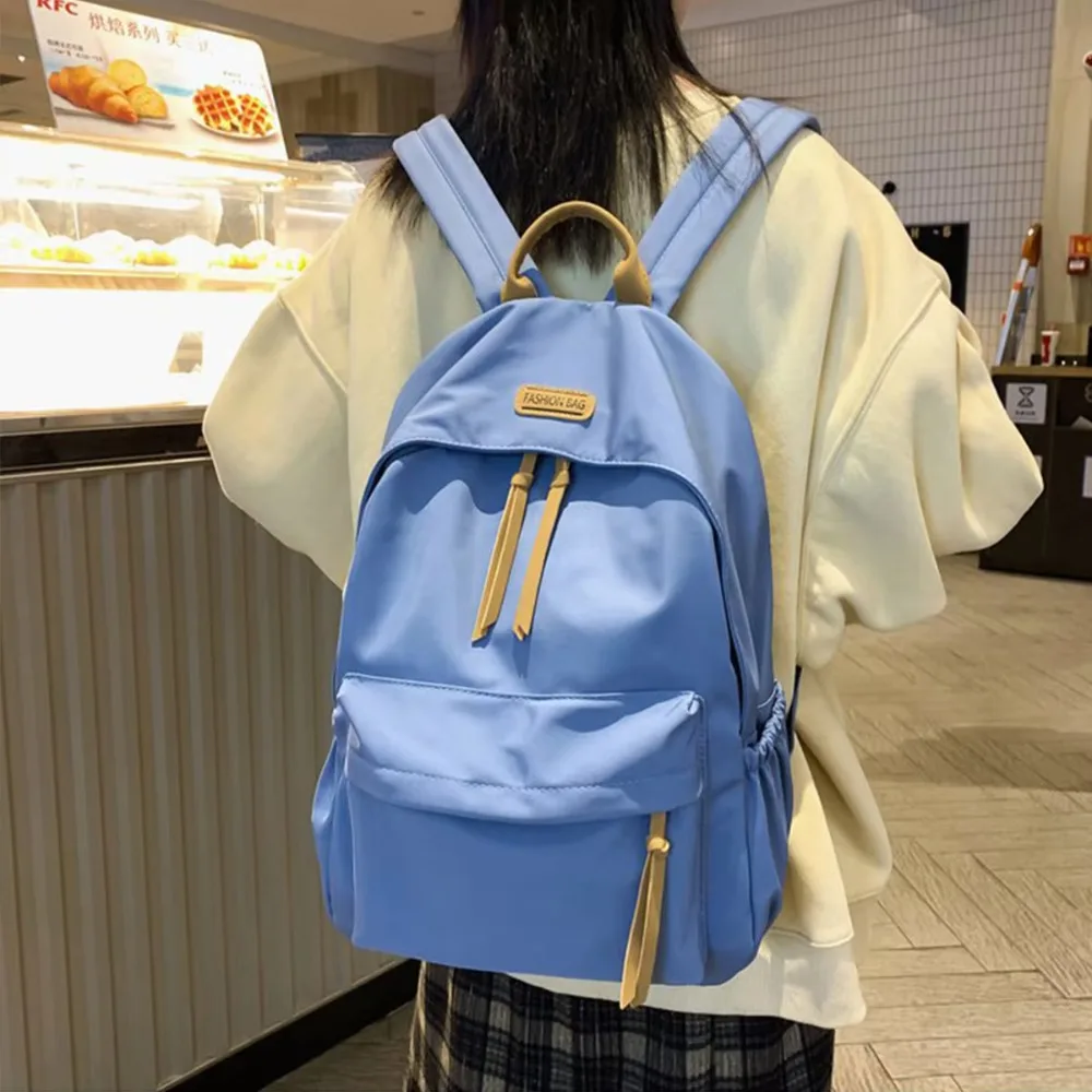 Mochila escolar duradera de Color sólido, bolso de nailon de gran capacidad a la moda, mochila ligera informal para estudiantes, uso diario