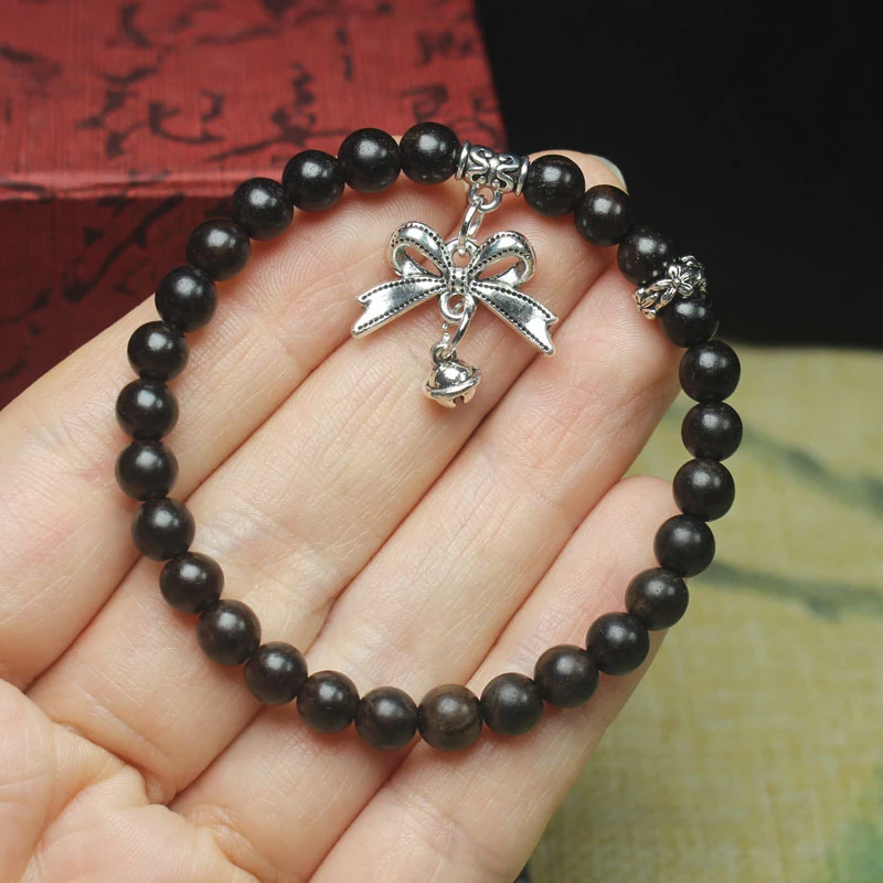 

Браслет из эбенового дерева 6 мм с серебряной подвеской-бантом, женский нишевый браслет, декоративные молитвенные и буддийские бусины, украшение.