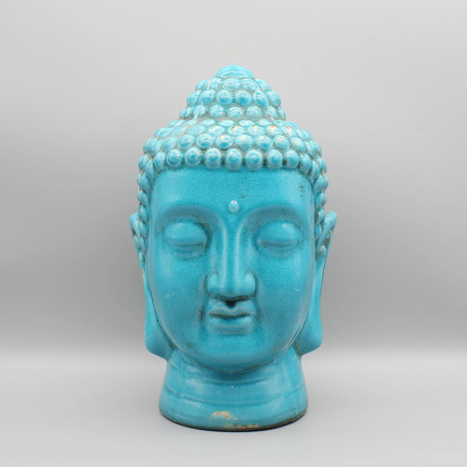 

Buddha head, ceramic statue