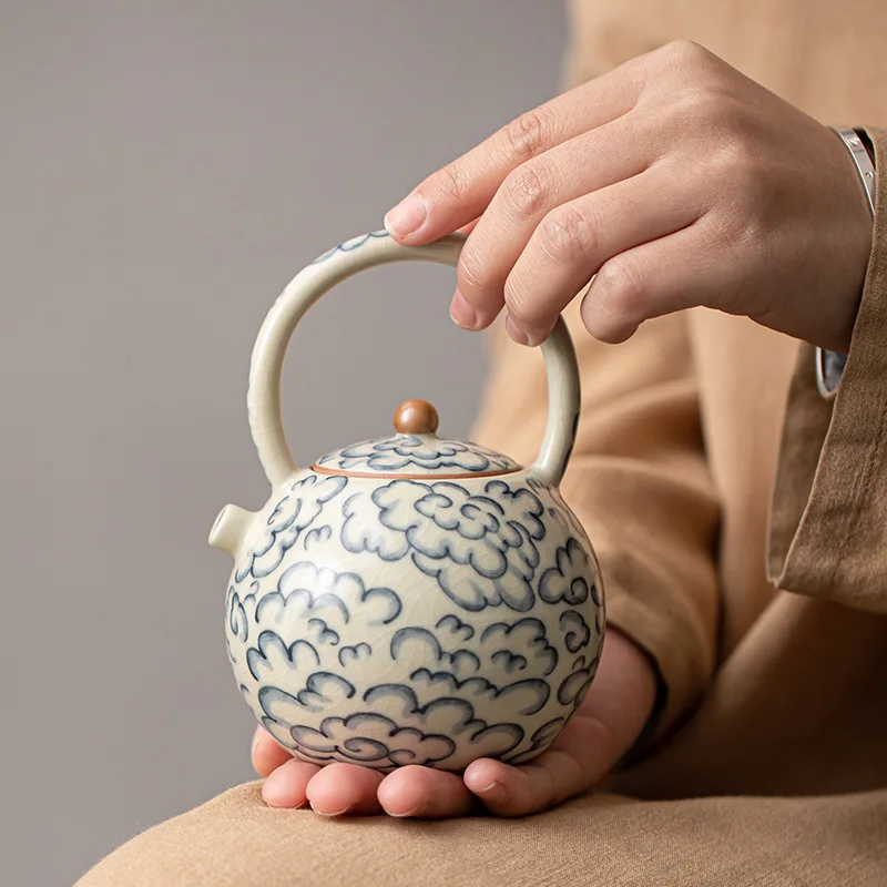 

Jingdezhen Tea Set Ru Kiln Underglaze Color Hand-painted Blue and White Teapot Household Beam Pot Kung Fu Tea Set Can Open Fire