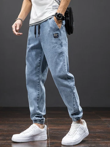 Primavera verão preto azul carga jeans homens streetwear denim jogger calças masculinas baggy harem jean calças plus size
