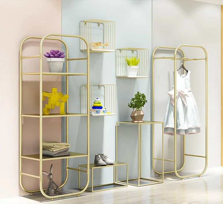 

Children's wear store display shelf Children's wear and shoes storage shelf Creative window display table