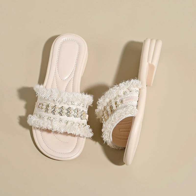 

Flat rhinestone slippers women 2026 new summer wear non-slip slip-on tassel flip-flops pearl beach shoes