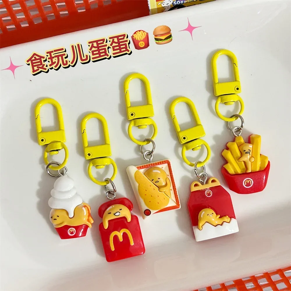 Kawaii Sanrio Gudetama imagen de dibujos animados patatas fritas huevos leche llaveros creativo divertido bolsa de comida colgante cremallera Mini juguete de decoración