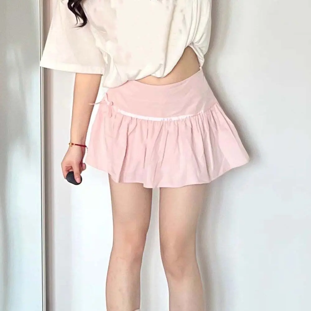 

Простые плиссированные мини-юбки трапециевидной формы с низкой талией в консервативном стиле, ультра короткие юбки в корейском стиле, эластичная мини-юбка с милым бантом для девочек и леди