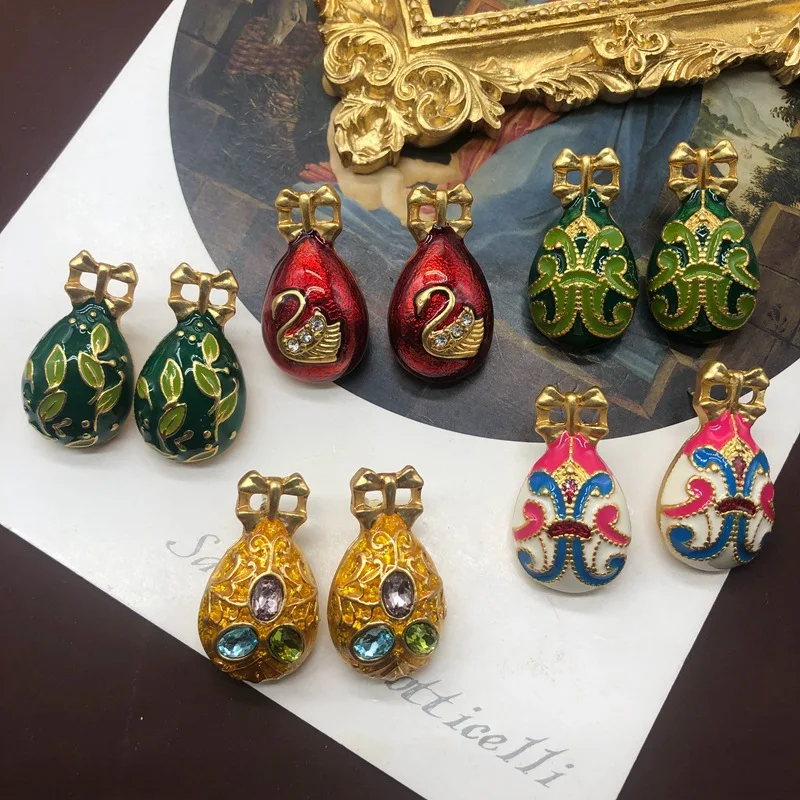 

Middle ancient colored enamel glaze gilded swan shaped colored egg earrings