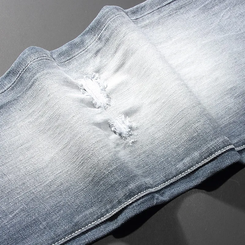 

Hombre street fashion new jeans light blue scratch elastic slim fit washed nostalgic elastic slim fit men's jeans hip-hop brand