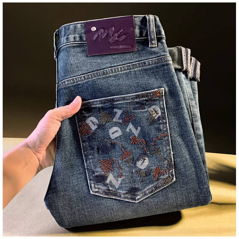 

2025This autumn and winter's popular men's jeans are new slim-fit stretch skinny pants with washed embroidery and printed design