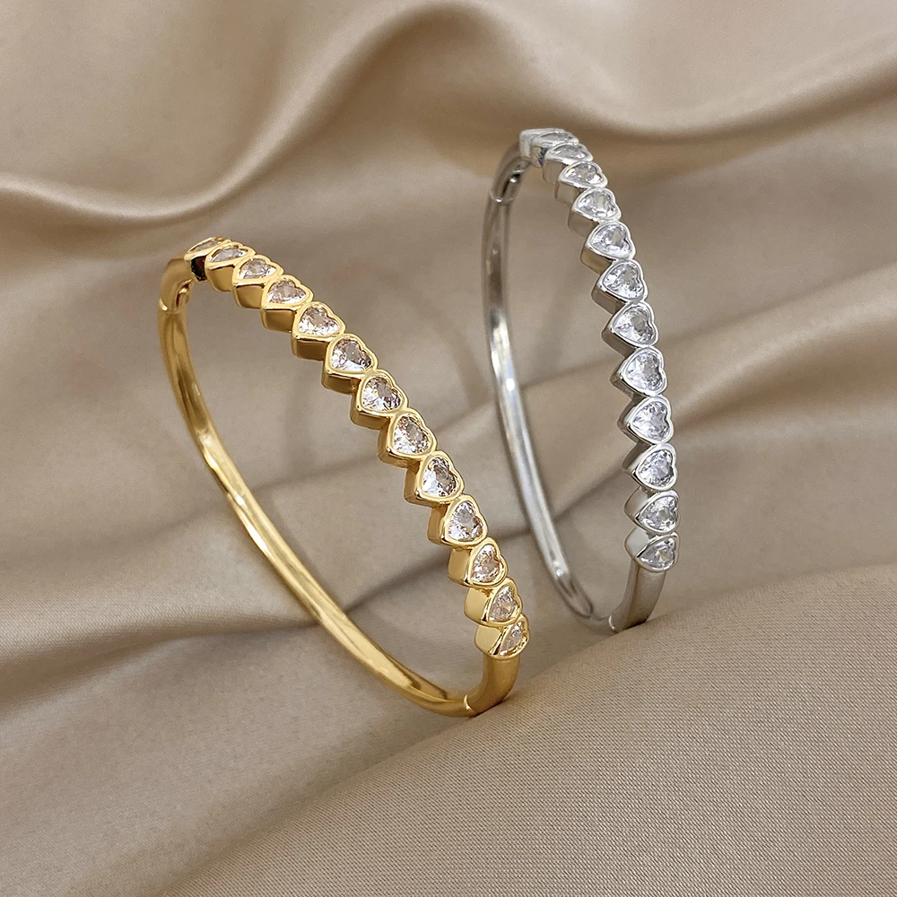 

DODOHAO Romantic Heart Zircon Spring Bangle Bracelet Women Elegant Geometric Gold Color Cuff Bracelet 2026 Fashion Jewelry Gift