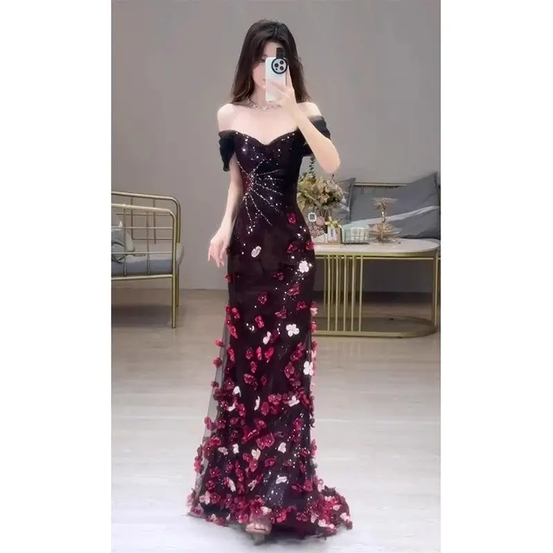 The burgundy mermaid evening gown with floral sequins suits various occasions, showing high-end sophistication.