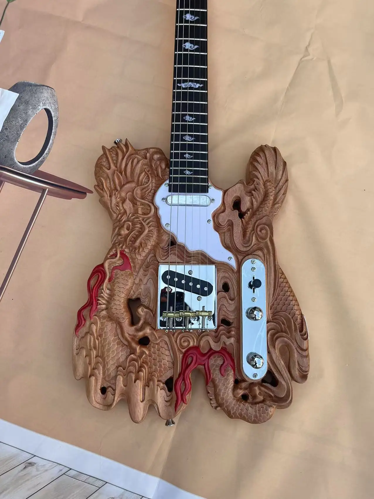 In stock, 6-chord dragon shaped carved electric guitar, with a natural wood color body and real shipping pictures. Order and shi