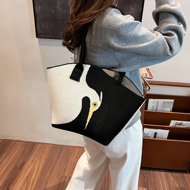 Bag worn on shoulder in urban winter setting