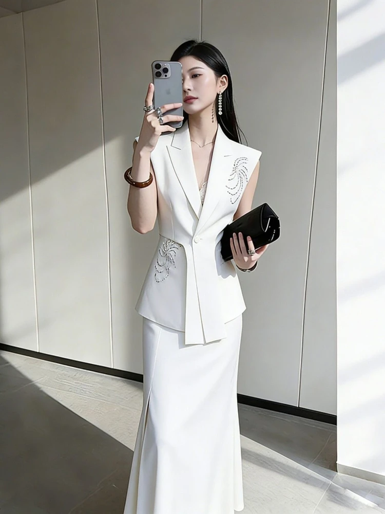 

Summer light mature temperament two-piece set female niche professional commuting high-end vest high waist slit half skirt