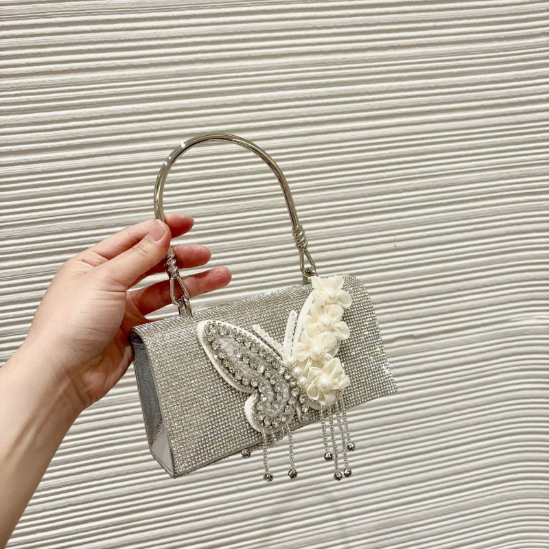 New fashion handbag with chain strap, pearl tassels, and butterfly wings, ultra-fairy wedding bag for women