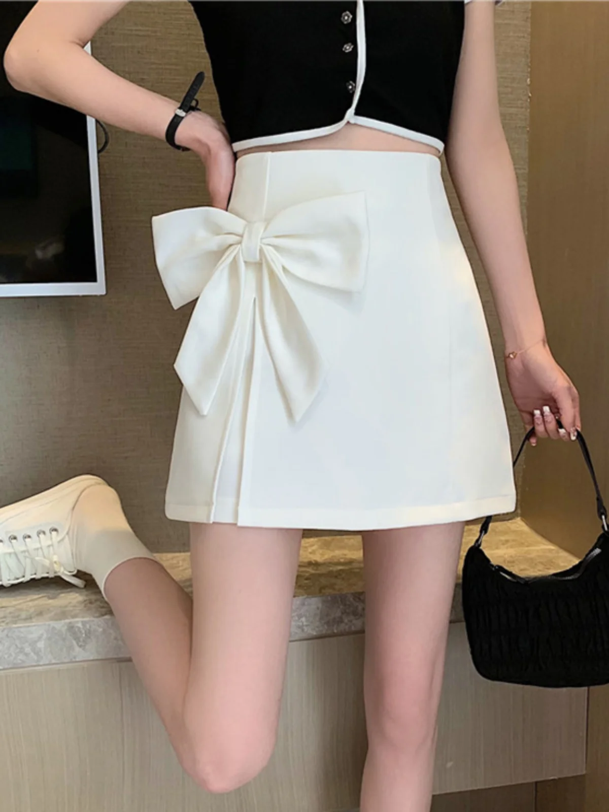 تنورة نسائية صيفية كبيرة الحجم عالية الخصر بفيونكة حلوة جديدة تنورة أنيقة بمزاج على شكل حرف a تنانير كورية متعددة الاستخدامات لتقليل العمر