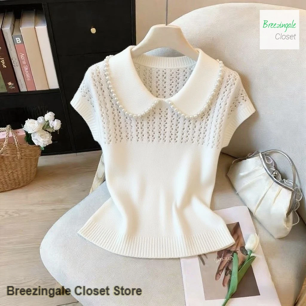 

Korean gentle wind blue Pearl doll collar knitted short-sleeved female summer hollow design sense niche slim temperament top