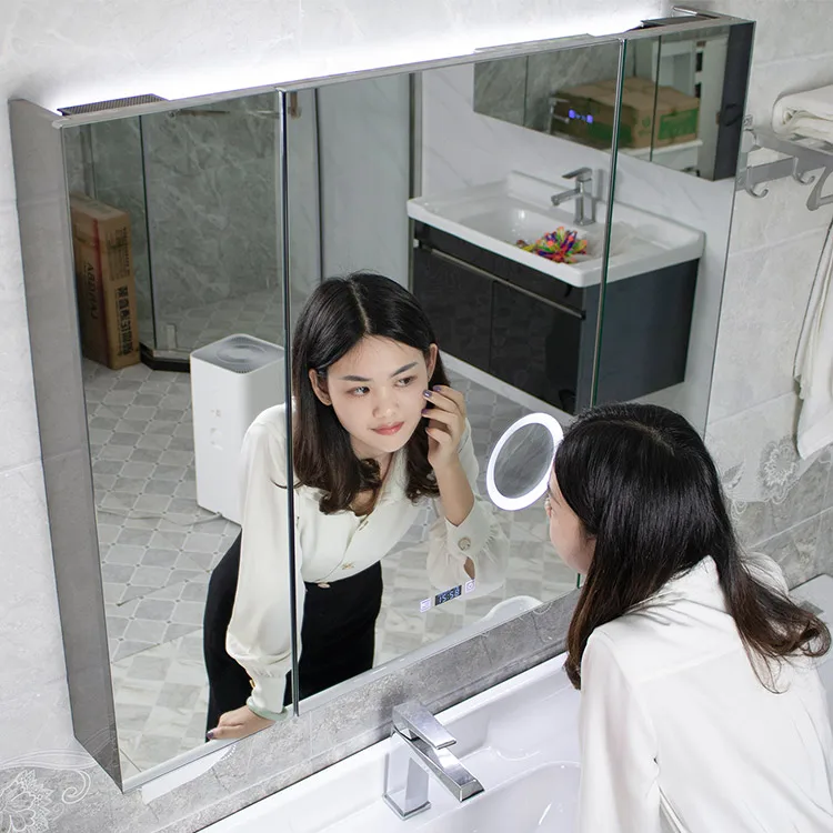 Magnifying lens LED backlit mirror illuminates bathroom mirror cabinet and anti-fogging wall-mounted vanity mirror cabinet