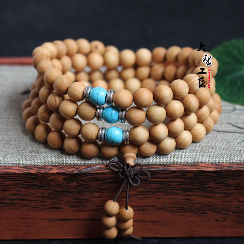 

with 108 8mm Buddhist beads, fresh medicinal scent, silk-patterned cypress wood bracelet