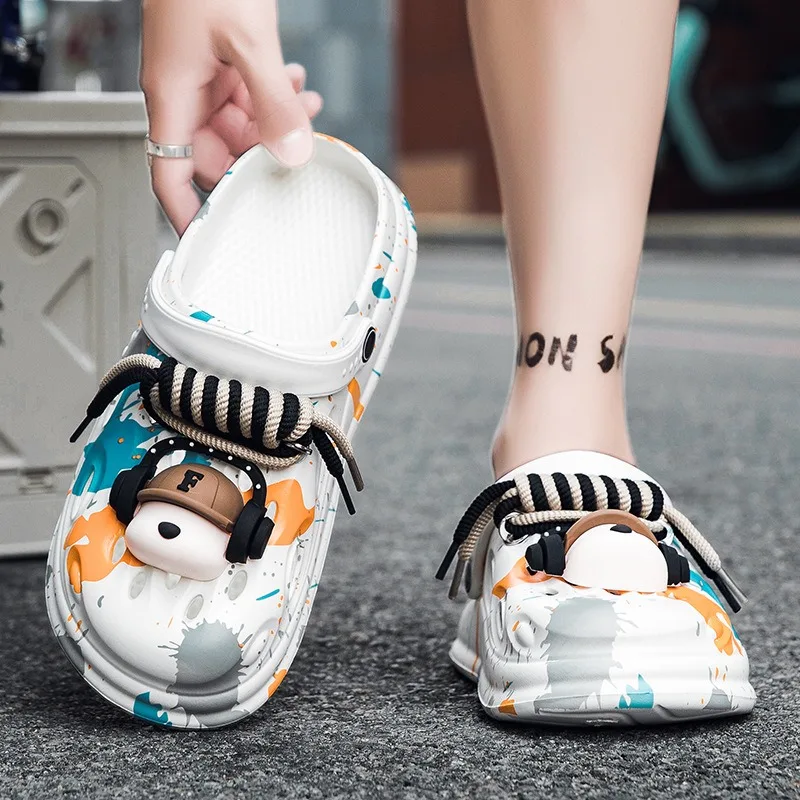 زوج من شباشب رجالية EVA ذاتية الصنع مزينة بسماعات أذن لطيفة ومثيرة للاهتمام، مناسبة للاستخدام الداخلي والخارجي على حد سواء