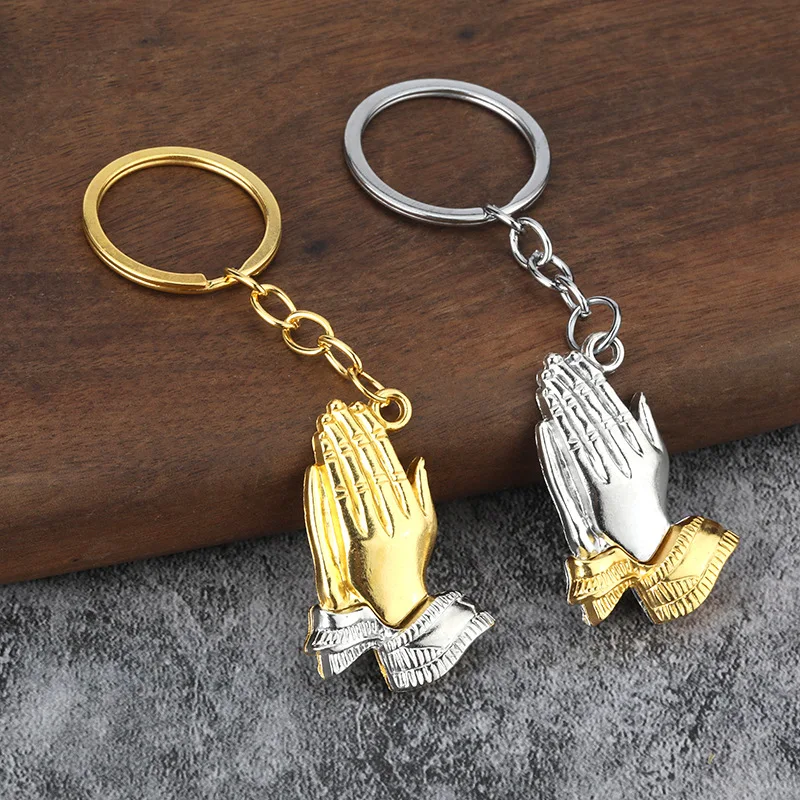 Innovative individual, palms joined together, welcomes both male and female keychains.