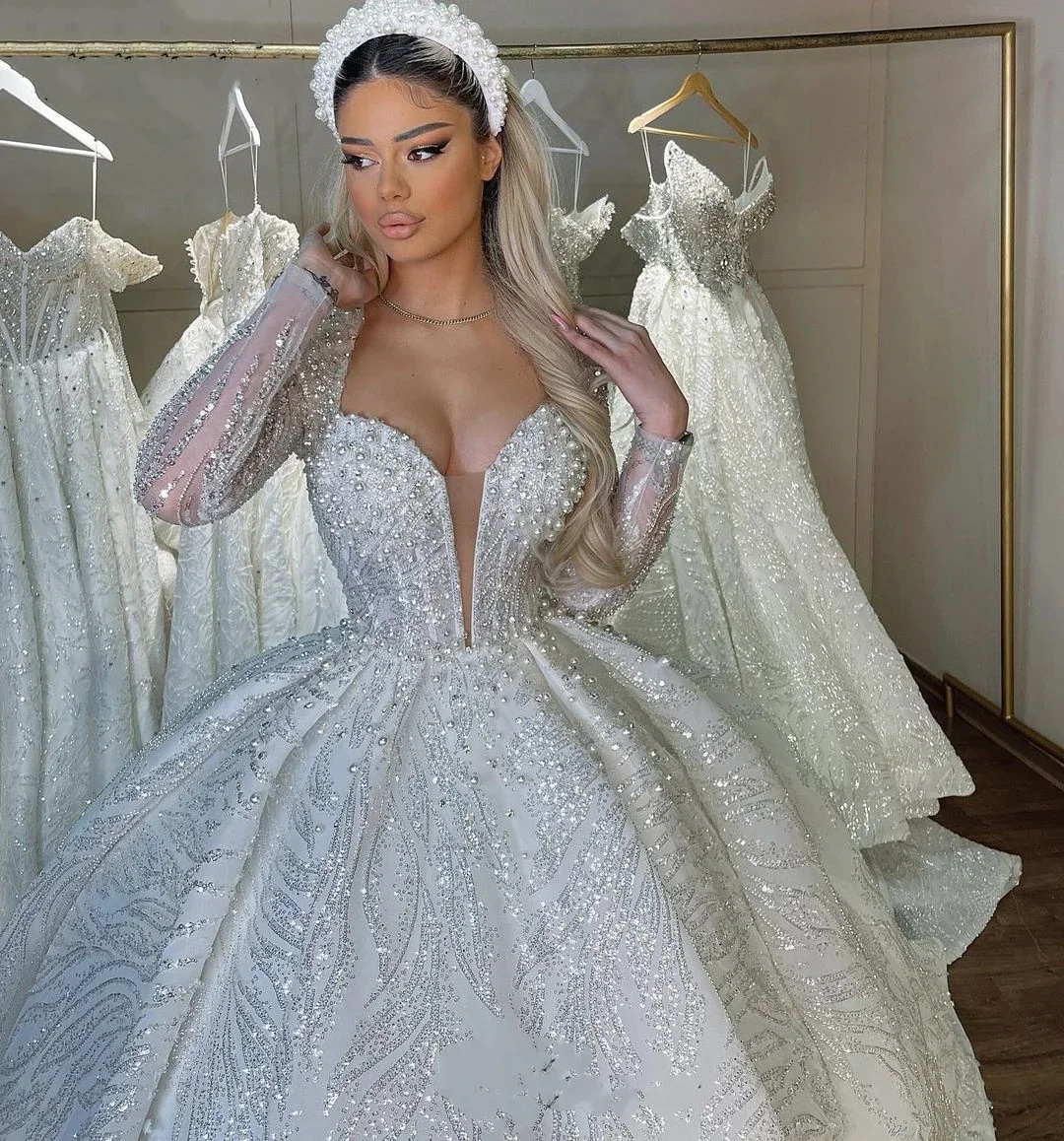 Personalizado dubai 2025 vestido de casamento mais pérolas lantejoulas vestidos de baile de noiva com decote em v mangas compridas vestidos de novia