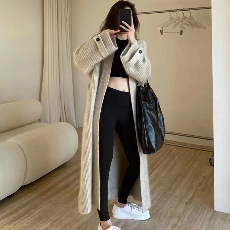 المرأة طويلة الأكمام سترة مشغولة من الصوف سترة 2025 الخريف الشتاء معاطف الموضة بلون المتضخم زر طويل جاكيتات الملابس