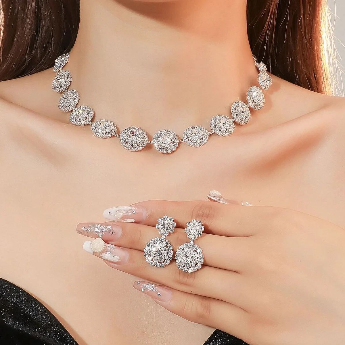 

Luxurious diamond-studded women's earrings and necklace set for the wedding season. Wedding necklaces as accessories.