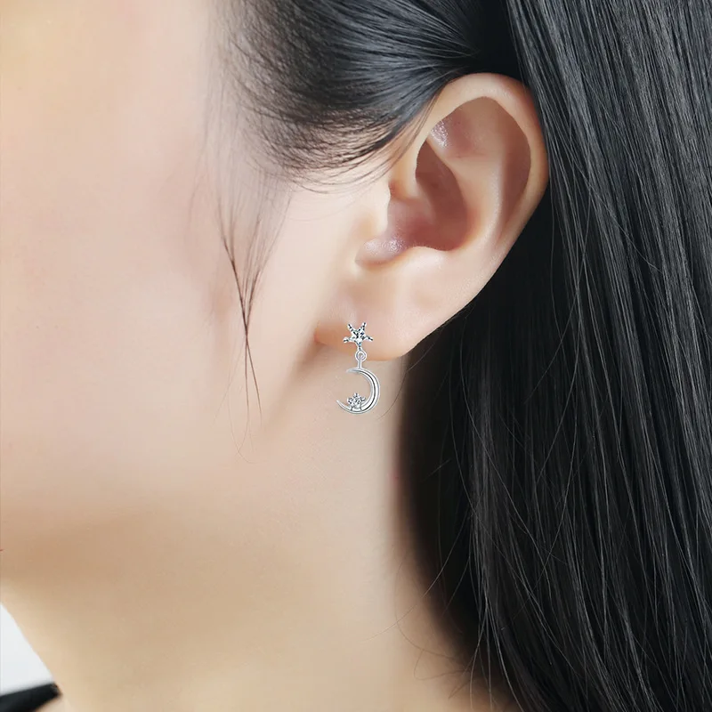 Korean version asymmetrical star and moon stud earrings made of S925 silver with fine inlays. Women's earrings. Anti-allergic