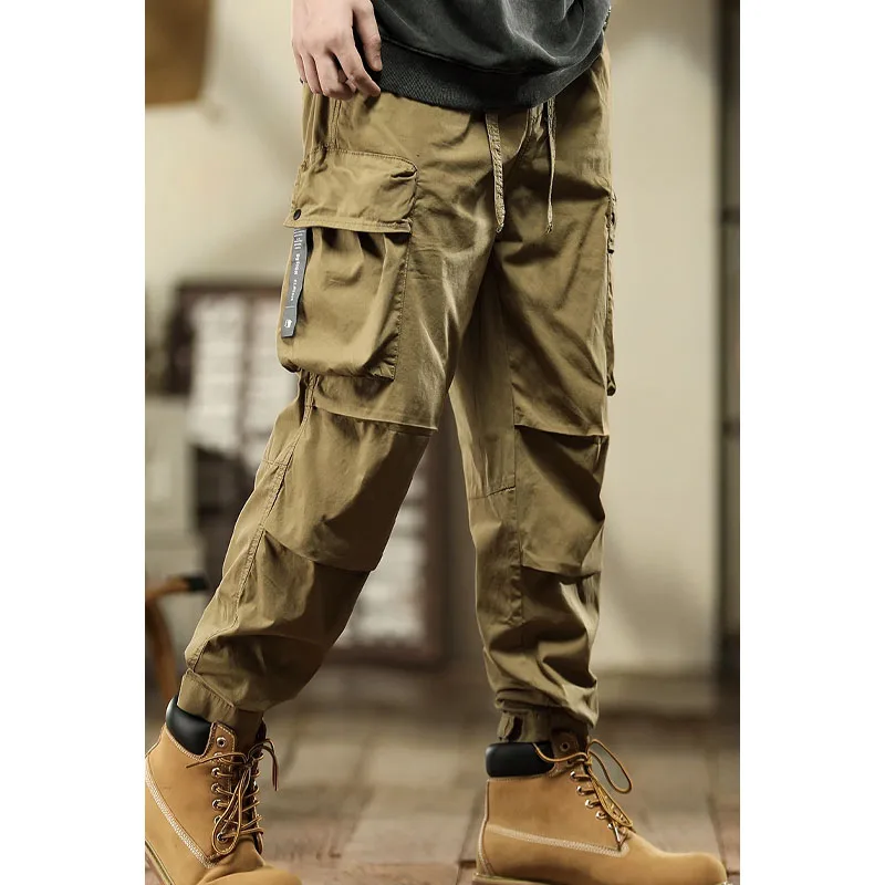 Calça esportiva masculina de bolso emendado com cordão, roupa monocromática, simples viajante, moda versátil, nova, primavera e outono