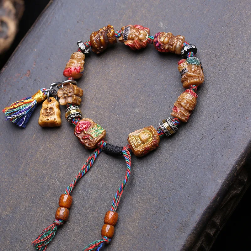 pulsera-de-multiples-tesoros-tallada-y-pintada-con-motivos-de-huesos-de-una-sola-hebra-que-representa-a-la-diosa-madre-a-zaki-y-al-dios-de-la-riqueza-amarilla-con