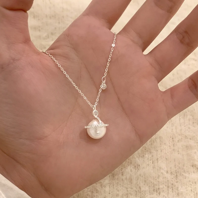 S925 فضة جميلة زحل قلادة المختنق قلادة بسيطة اللؤلؤ قلادة المرأة هدية الزفاف بوتيك غرامة مجوهرات