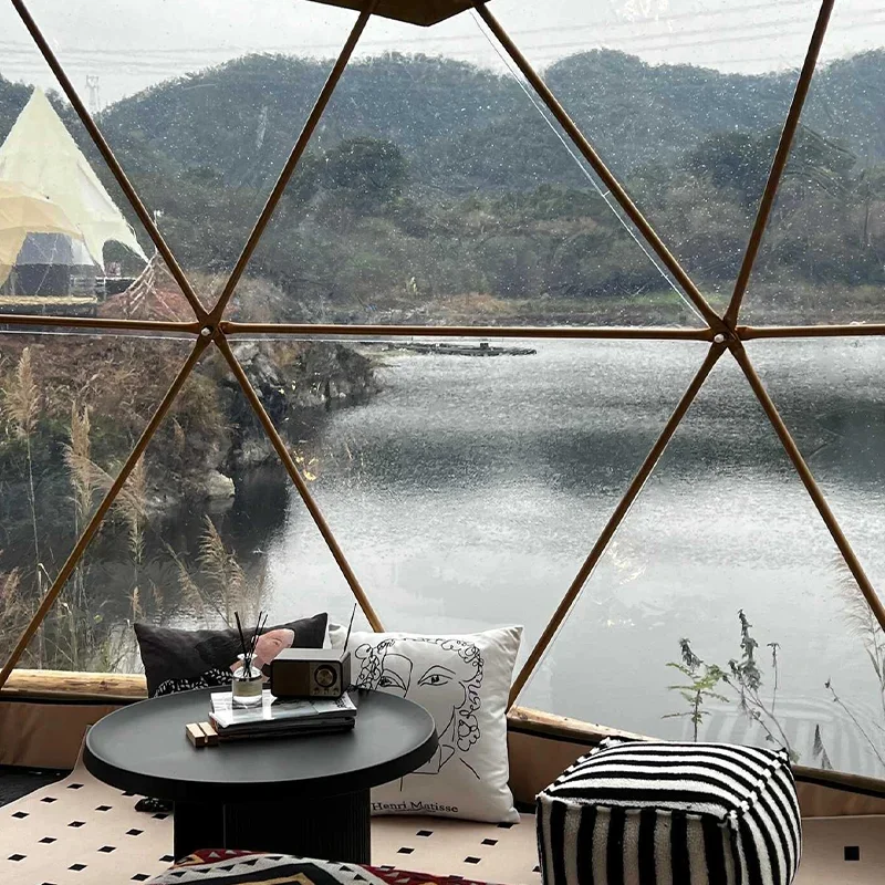 A luxury dome tent with a private bathroom and kitchenette, ideal for a hotel-style outdoor stay