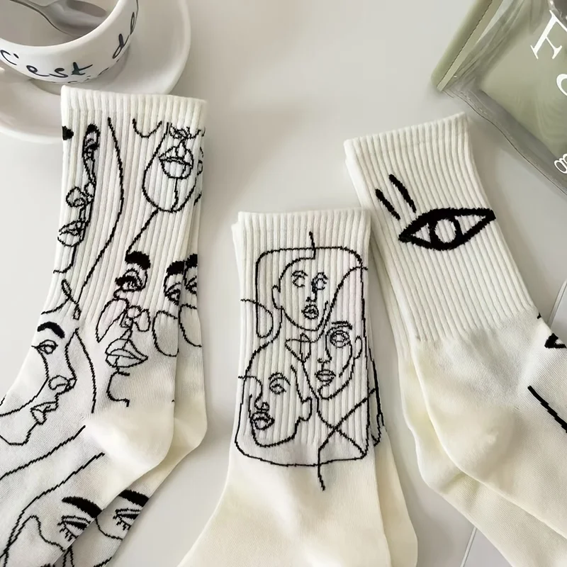 

3 pairs of women's fashionable mid tube socks - black and white artistic line design, versatile for casual or formal wear