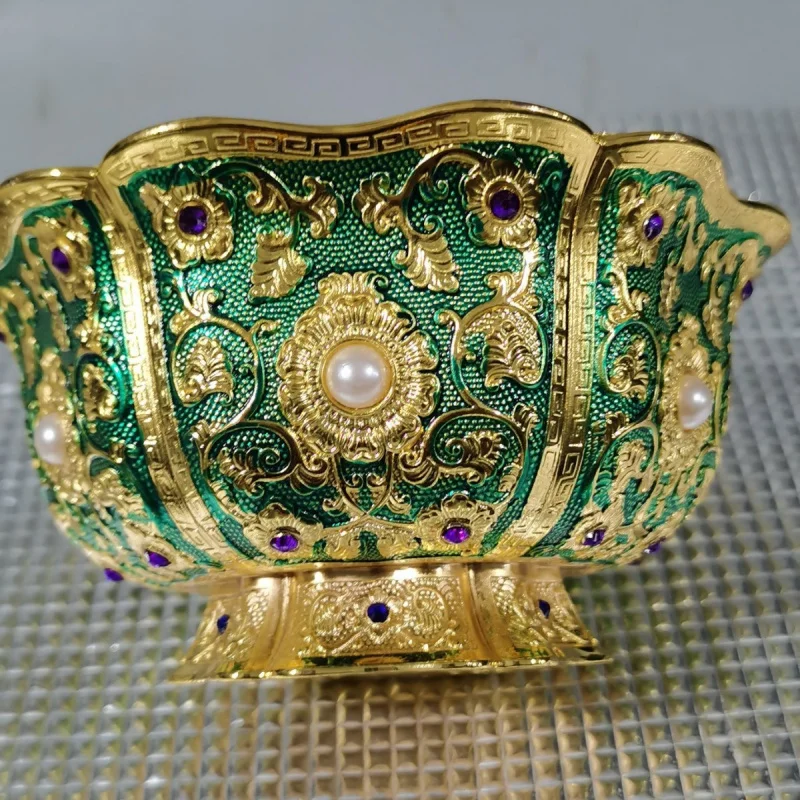 Gilt copper bowl with six-petal floral and vine patterns, handcrafted with inlaid gemstones, a vintage decorative bowl symbolizi