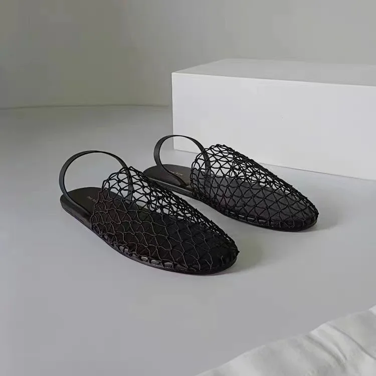 

2024 summer new niche designer flat shoes women's hollowed out mesh breathable sandals woven one word slippers for external wear